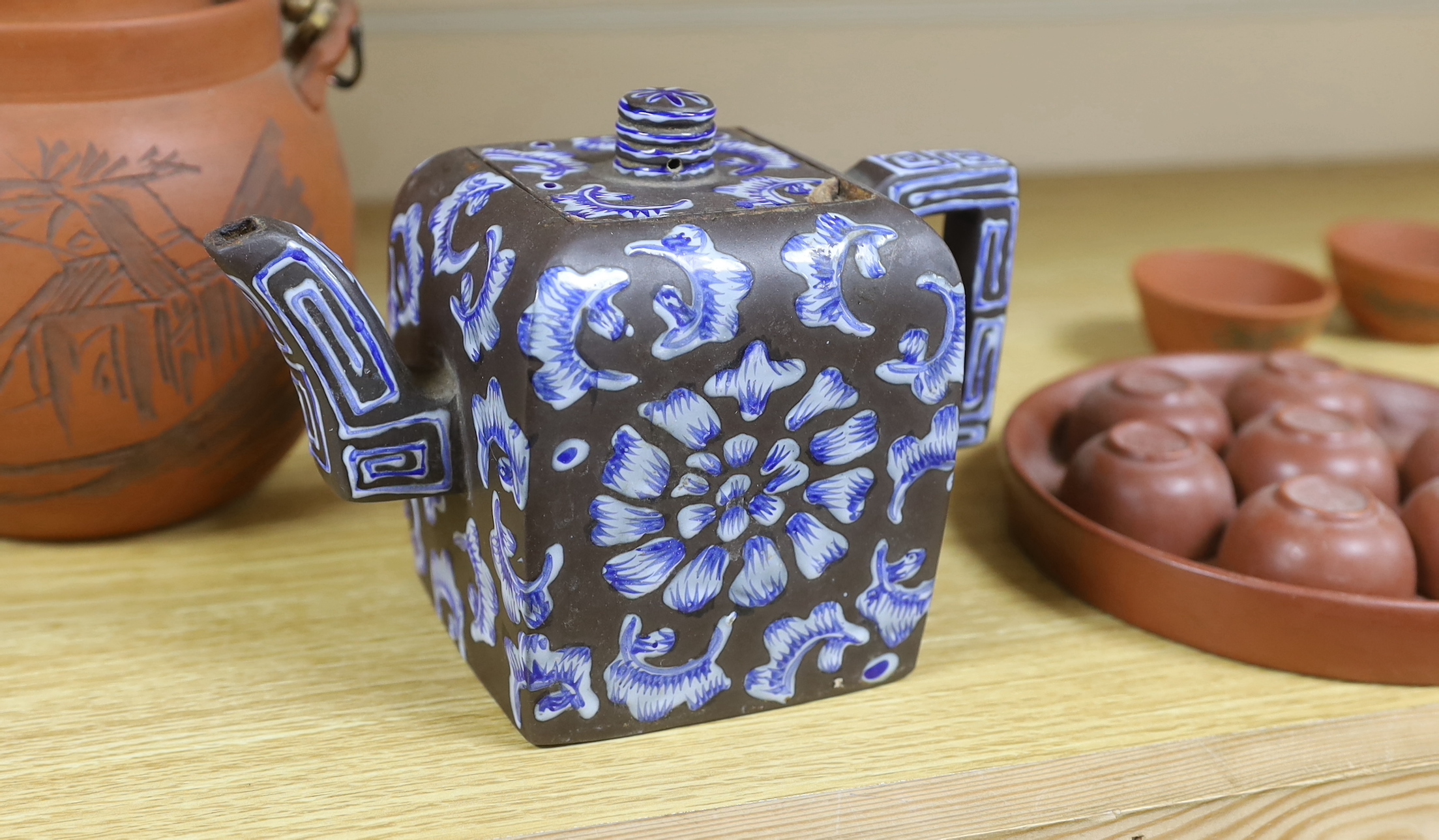 A quantity of Chinese Yixing teapots and terracotta tea bowls, the largest 20cm wide